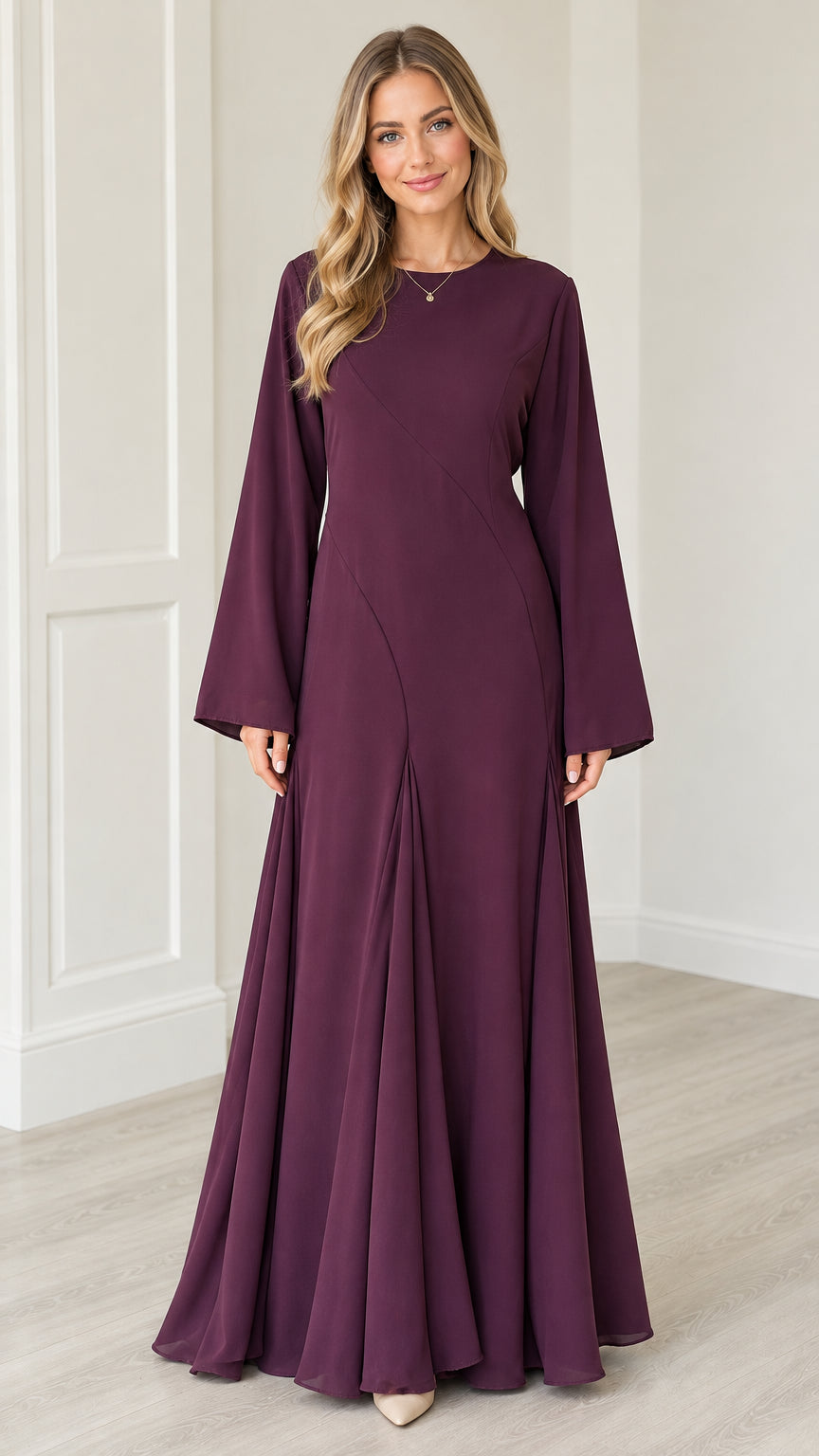 Front view of woman wearing Plum bell sleeve A-line maxi dress