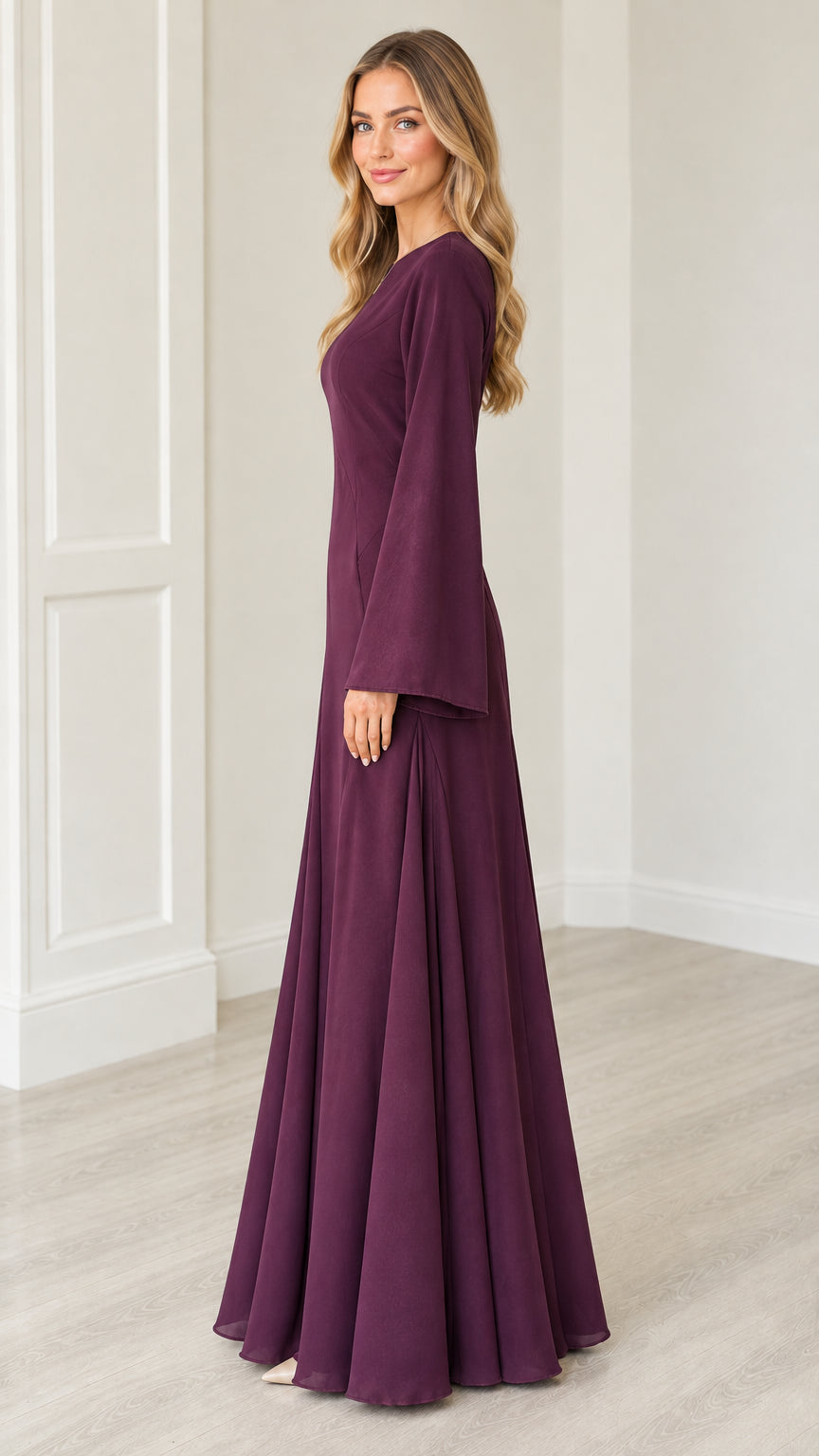 Side profile view of woman modeling Plum long sleeve flared maxi gown