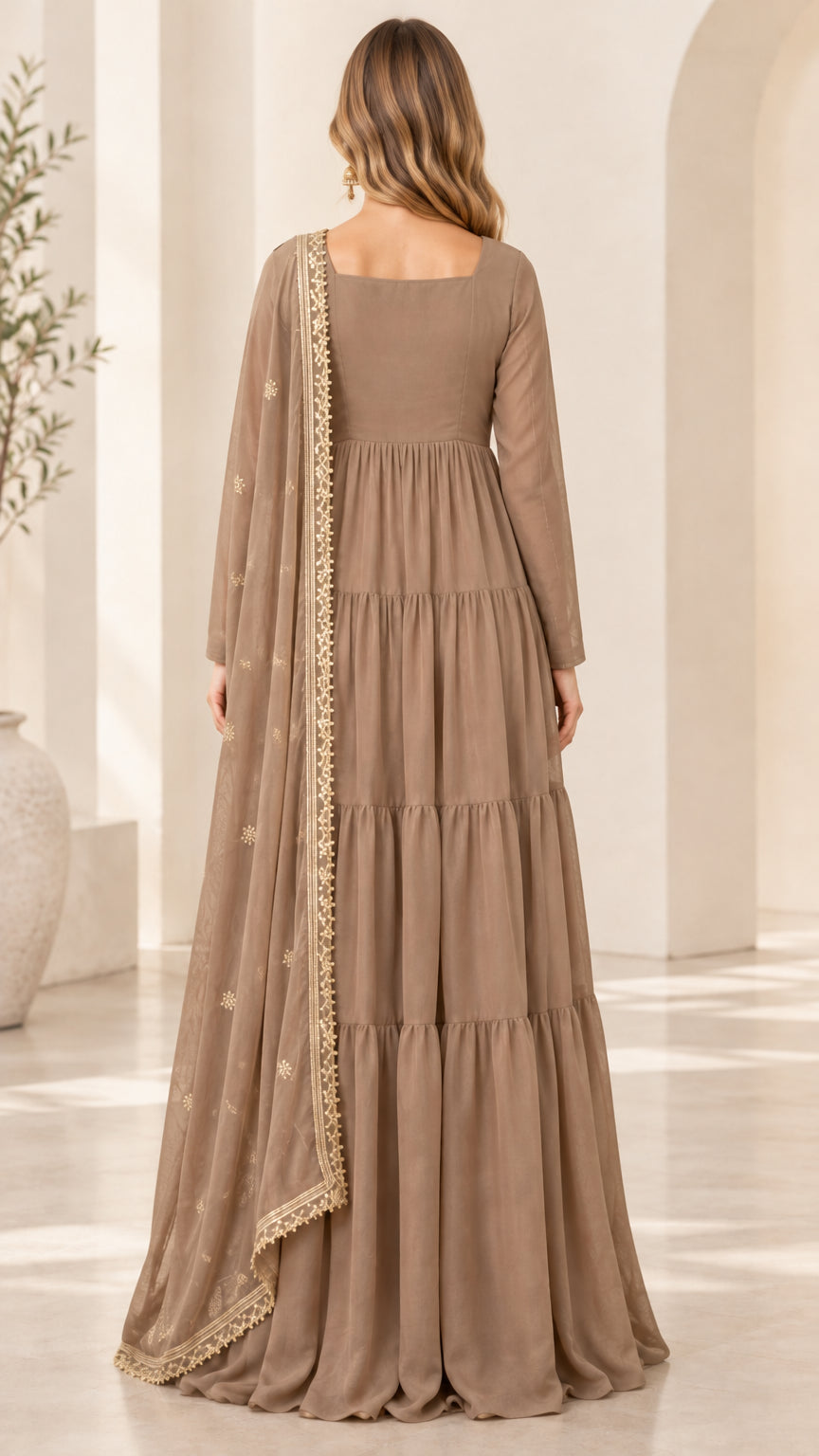 Back view of taupe tiered maxi dress showing gathered skirt layers and draped dupatta