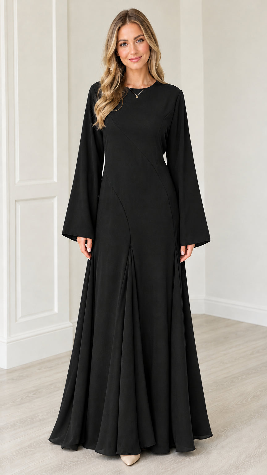 Front view of woman wearing Black bell sleeve A-line modest maxi dress
