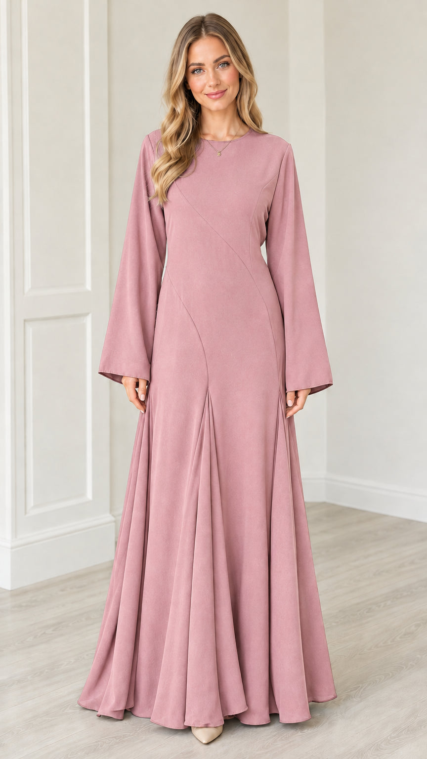 Front view of woman wearing Dusty Pink bell sleeve flared maxi dress