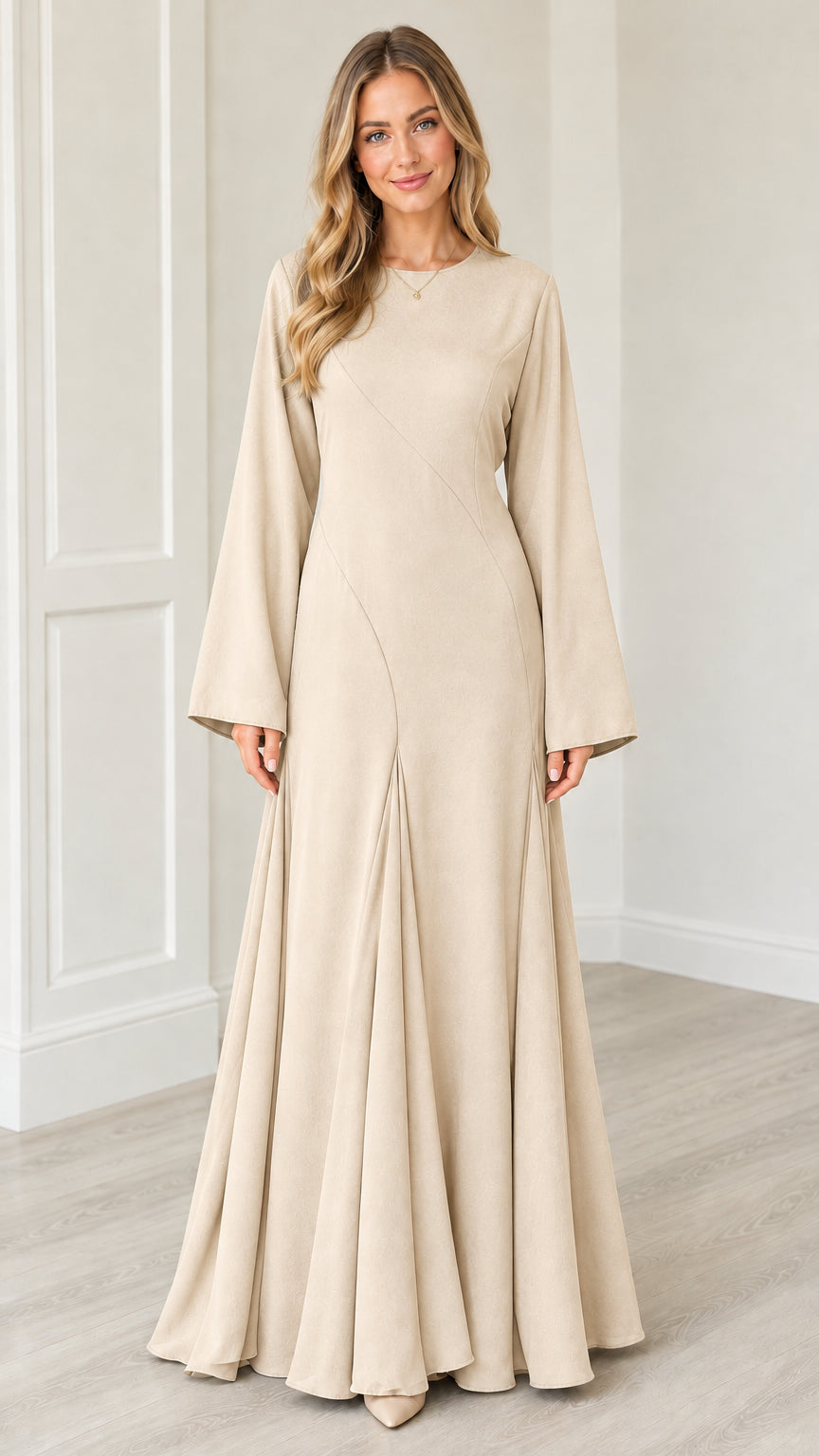 Front view of woman wearing Beige bell sleeve flowing modest maxi gown